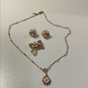 Vintage three piece jewelry set. Clip-on earrings, brooch and necklace